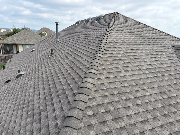 Revamped Roofing arial view of new residential home exterior renovations
